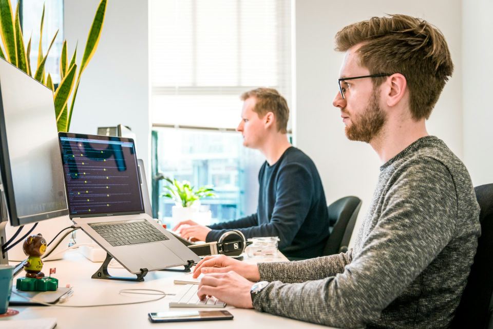 Designers and developers working together in an office